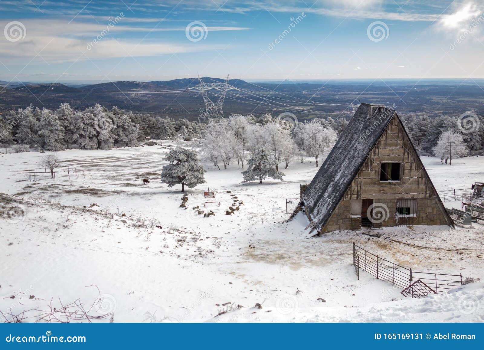 triangular d cabin on a snowy mountain during winter