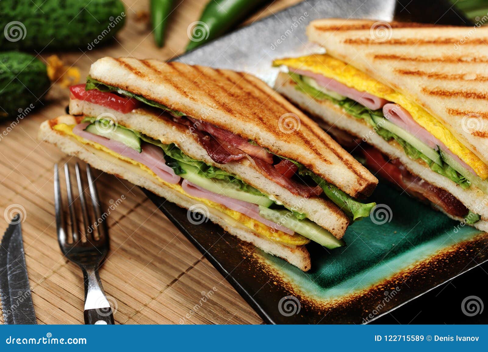 Triangular Shaped Sandwiches with Ham and Omelet on a Plate Stock Image