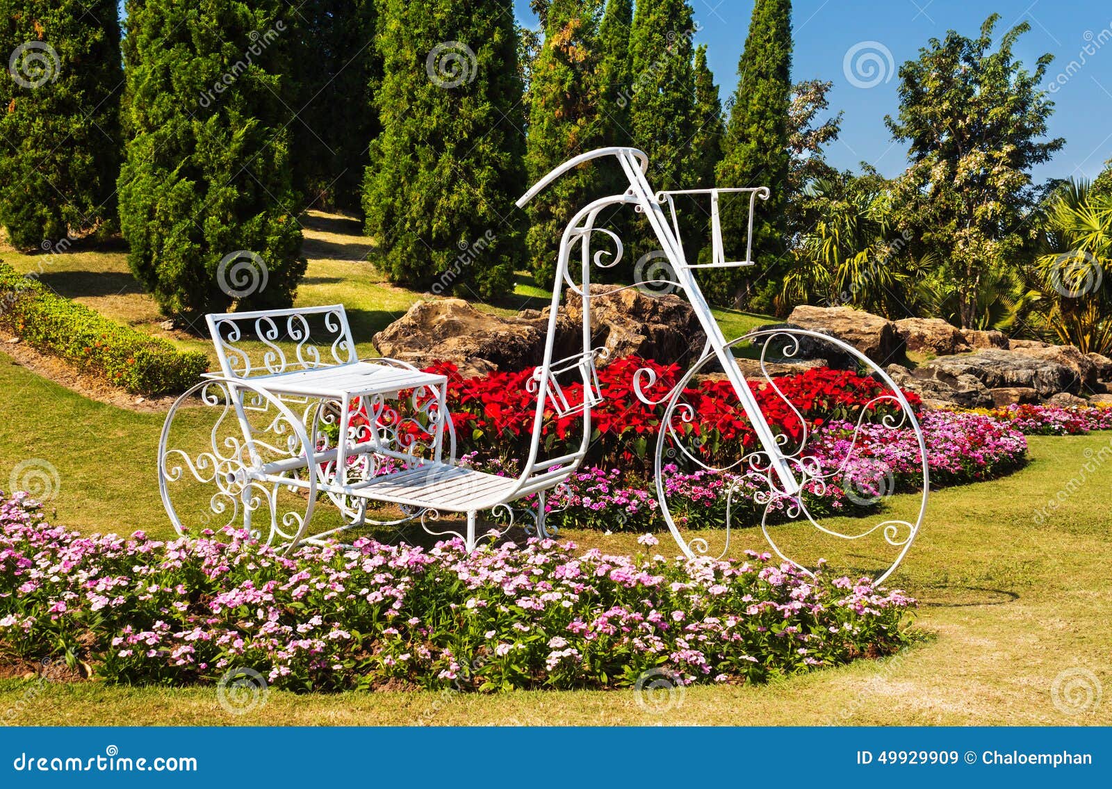 Tricycle in garden design. stock image. Image of gardening 49929909