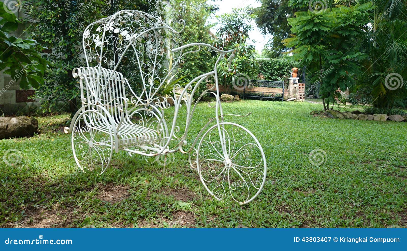 Tricycle in the garden stock image. Image of tricycle 43803407