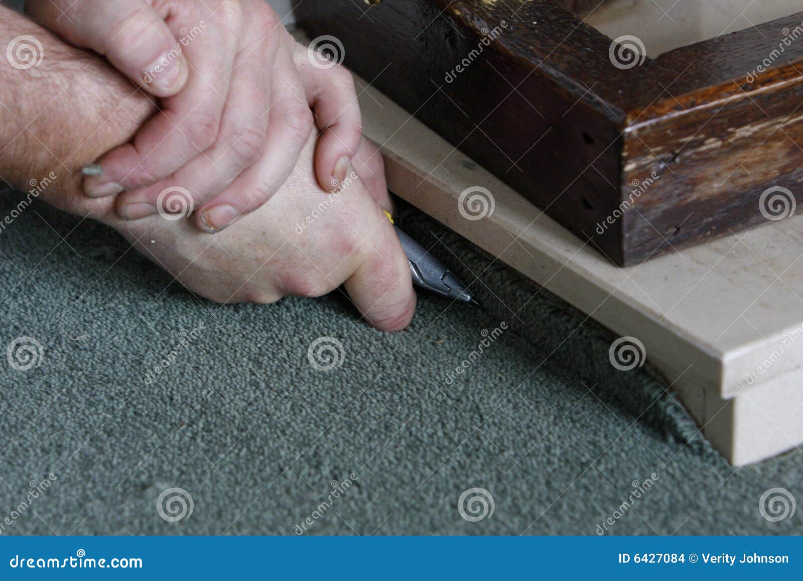 Triming the carpet stock photo. Image of working, floor 6427084