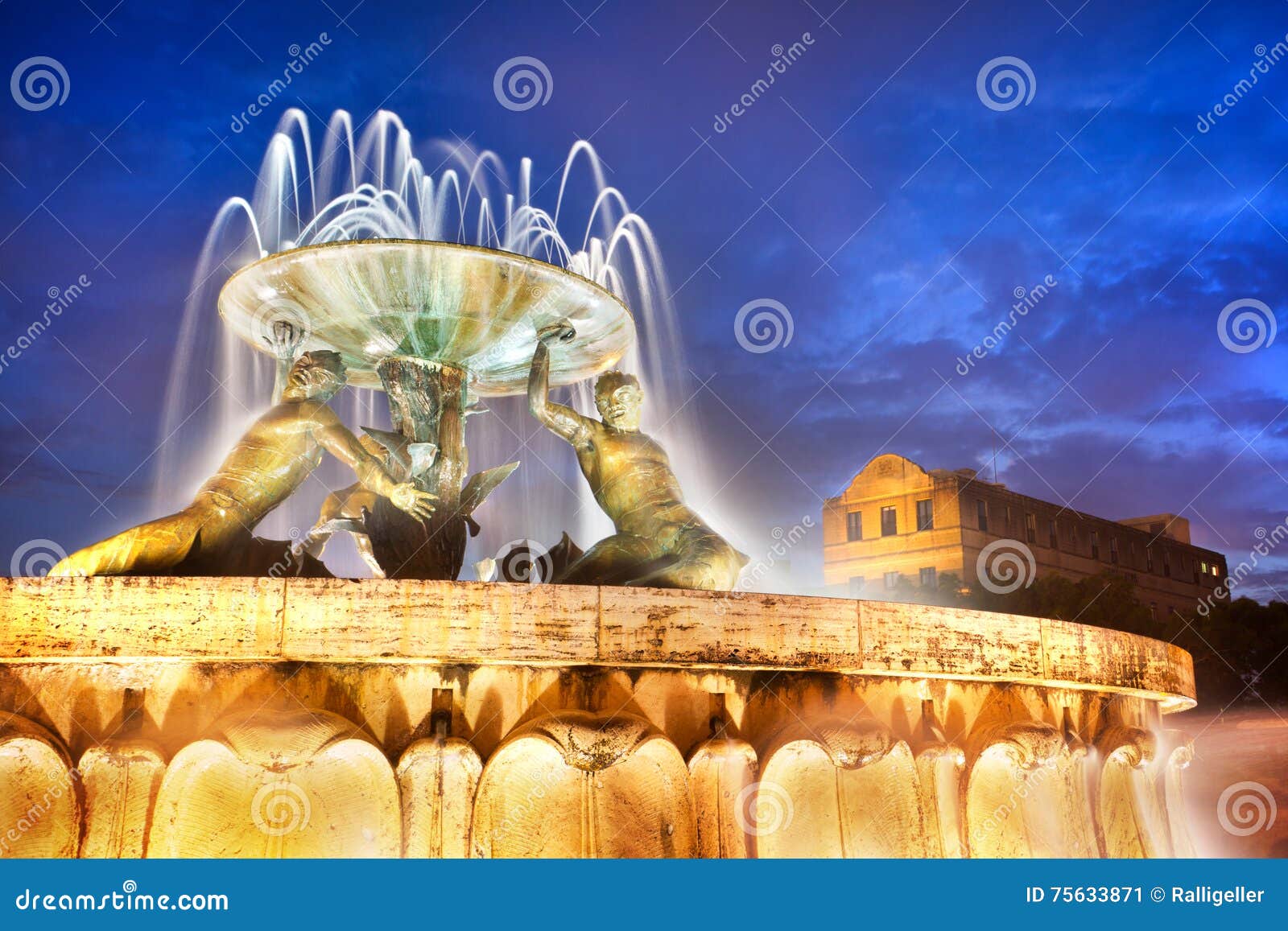 the triton fountain at the entrance of valletta, malta