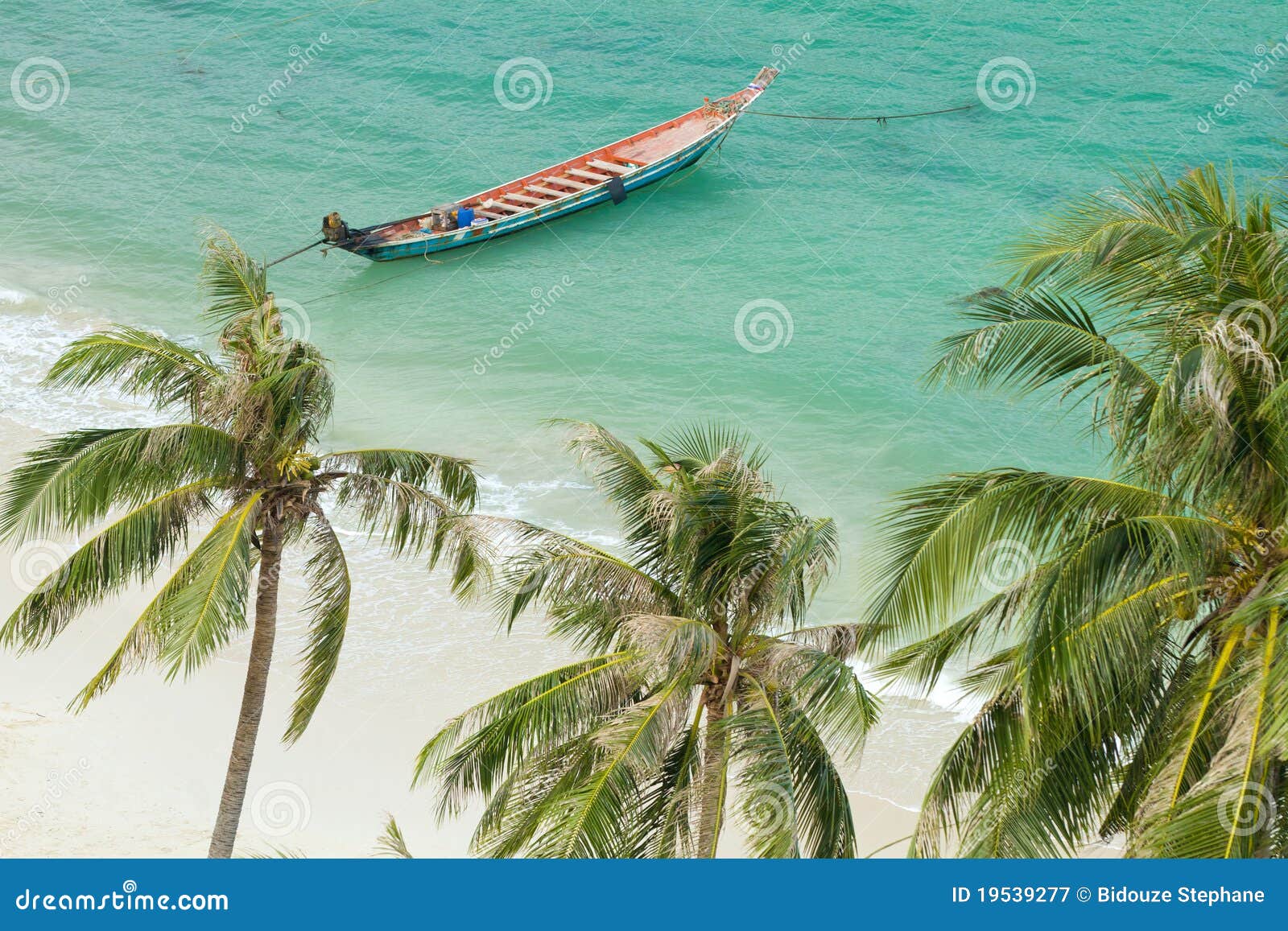 tropical beach and rowboat