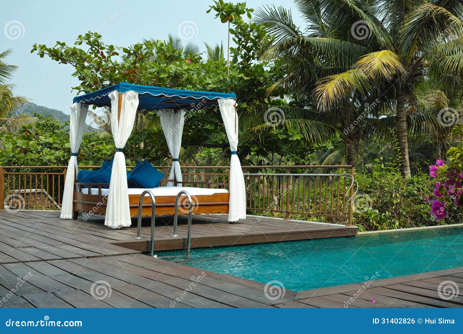 tropical cabana and swimming pool