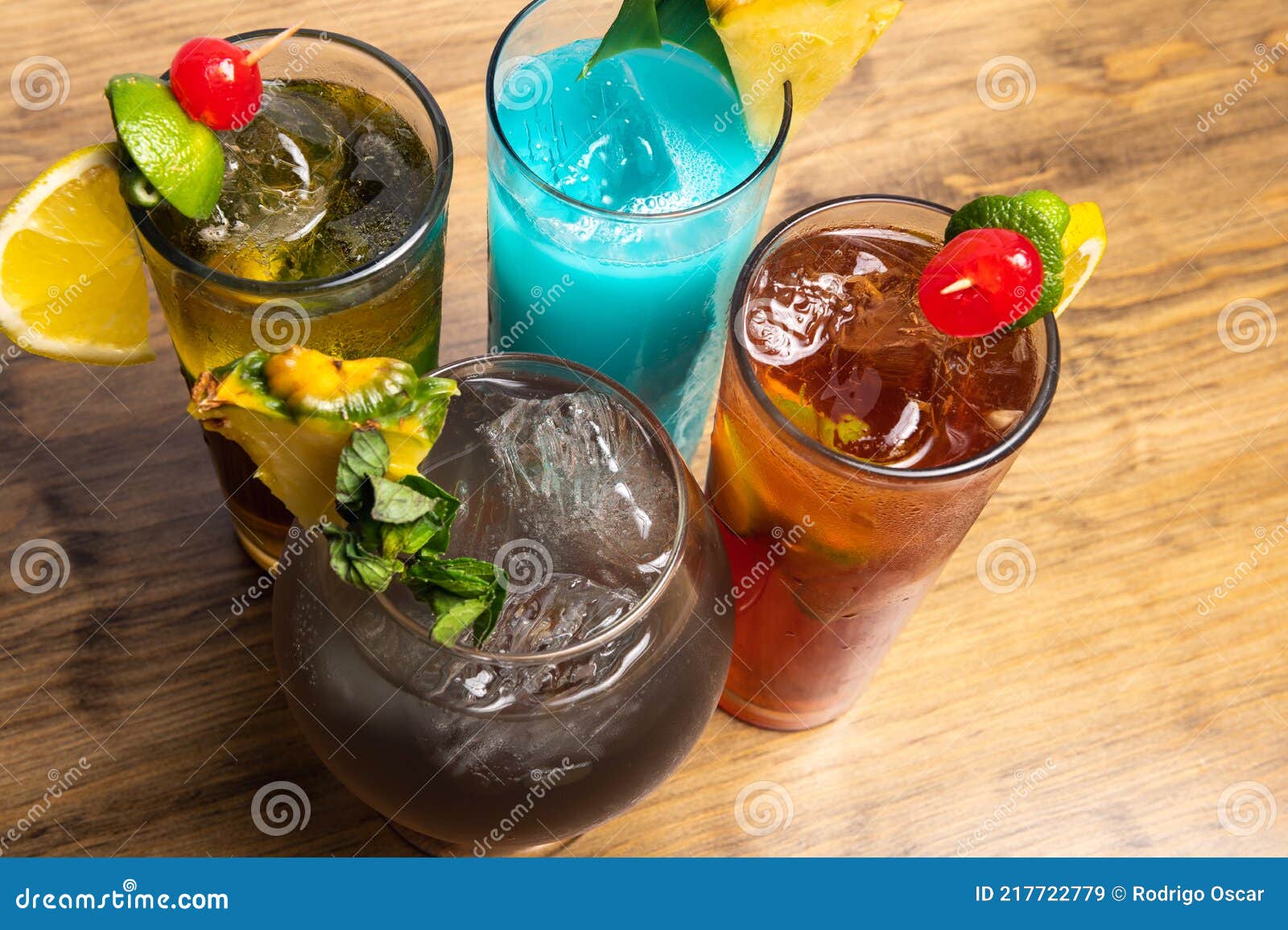 tropical cocktails on wooden background. frutal alcoholic cocktails. colorful drinks concept