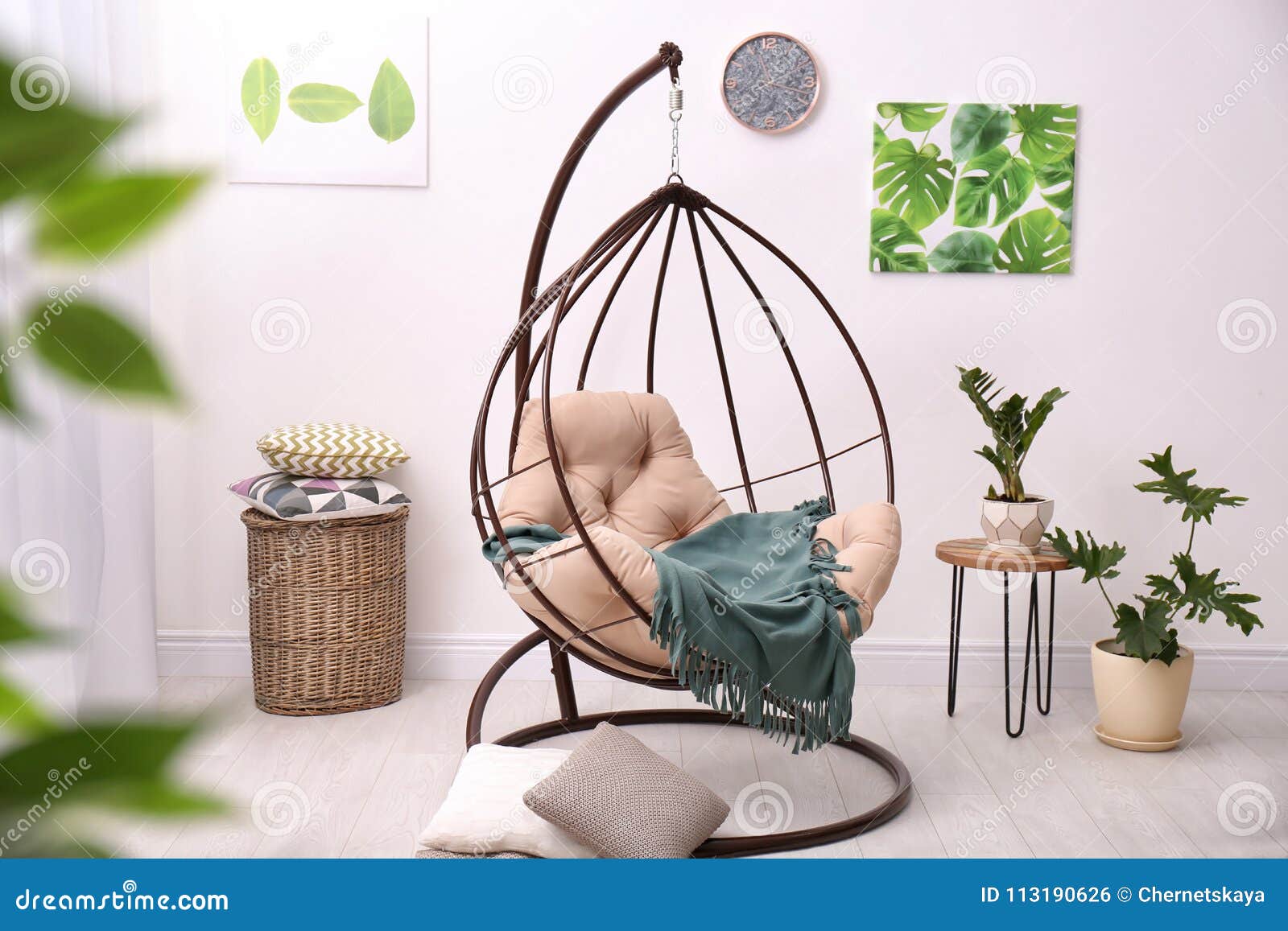 Tropical Plants With Green Leaves And Swing Chair Stock