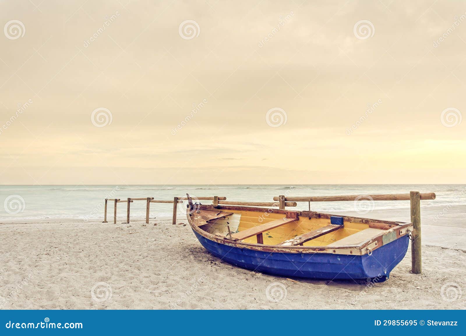 Old Yellow Blue Wooden Boat On White Beach On Warm Sunset ...