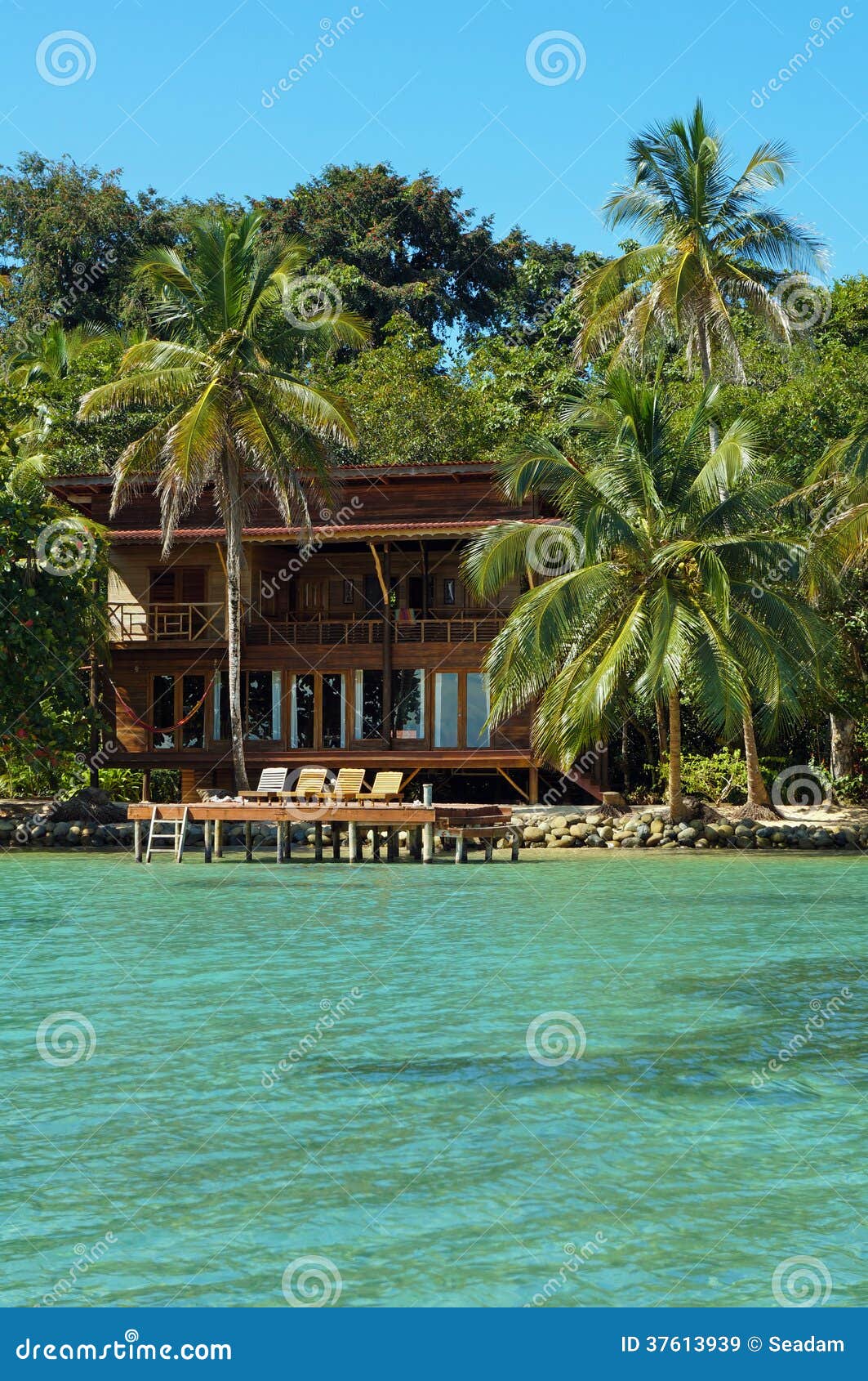 Tropical Seaside House with Dock and Lounger Stock Image Image of