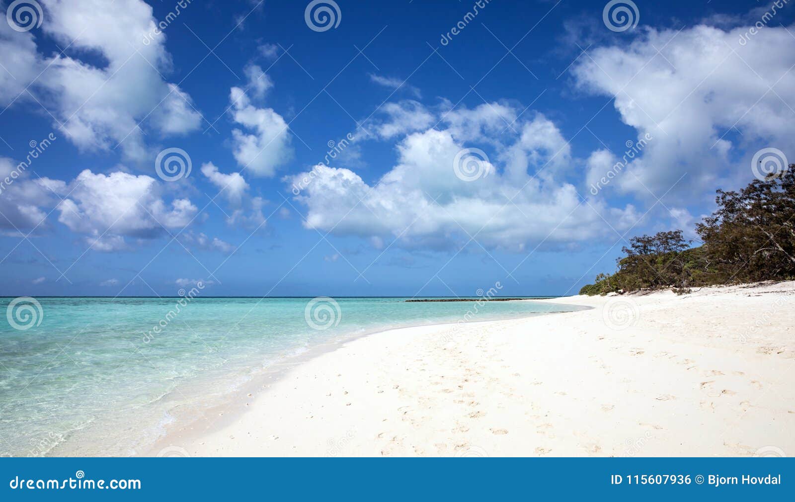 Crystal clear water of the tropical sea and white sand beach