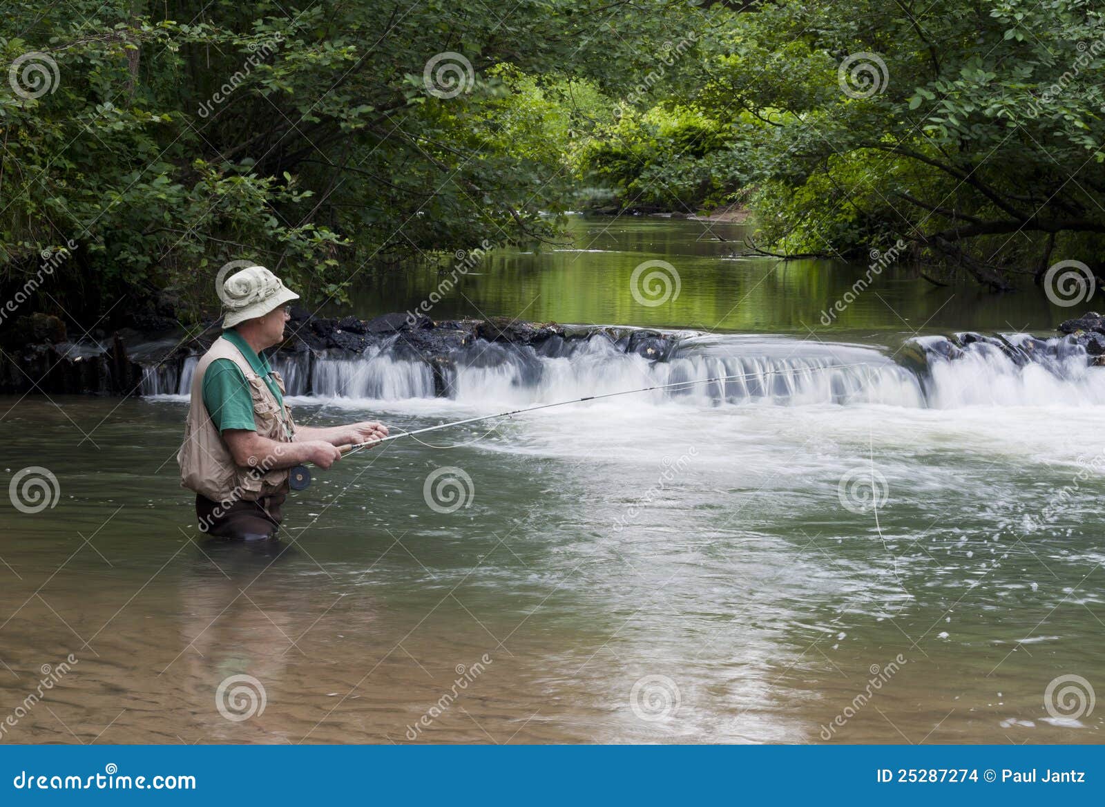 Trout fisherman stock photo. Image of vest, river, waterfall 25287274