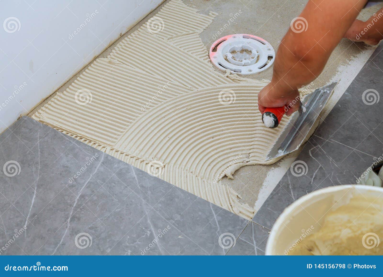 Troweling Mortar A Concrete Floor In Preparation For Laying Floor