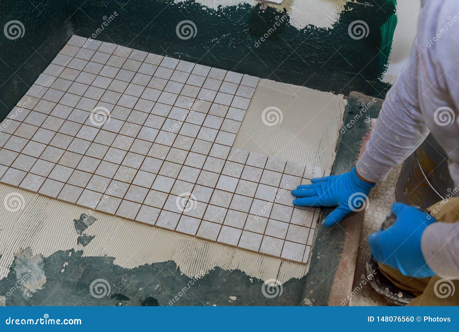 Troweling Mortar A Concrete Floor In Preparation For Laying Floor