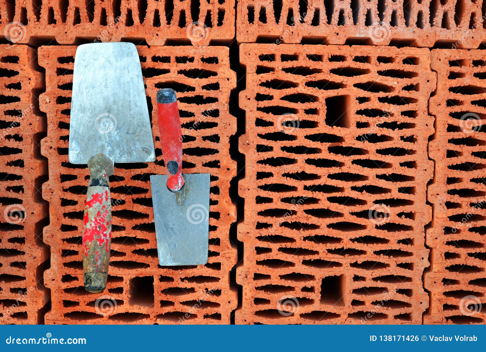 Trowels on a red brick. stock photo. Image of building 138171426
