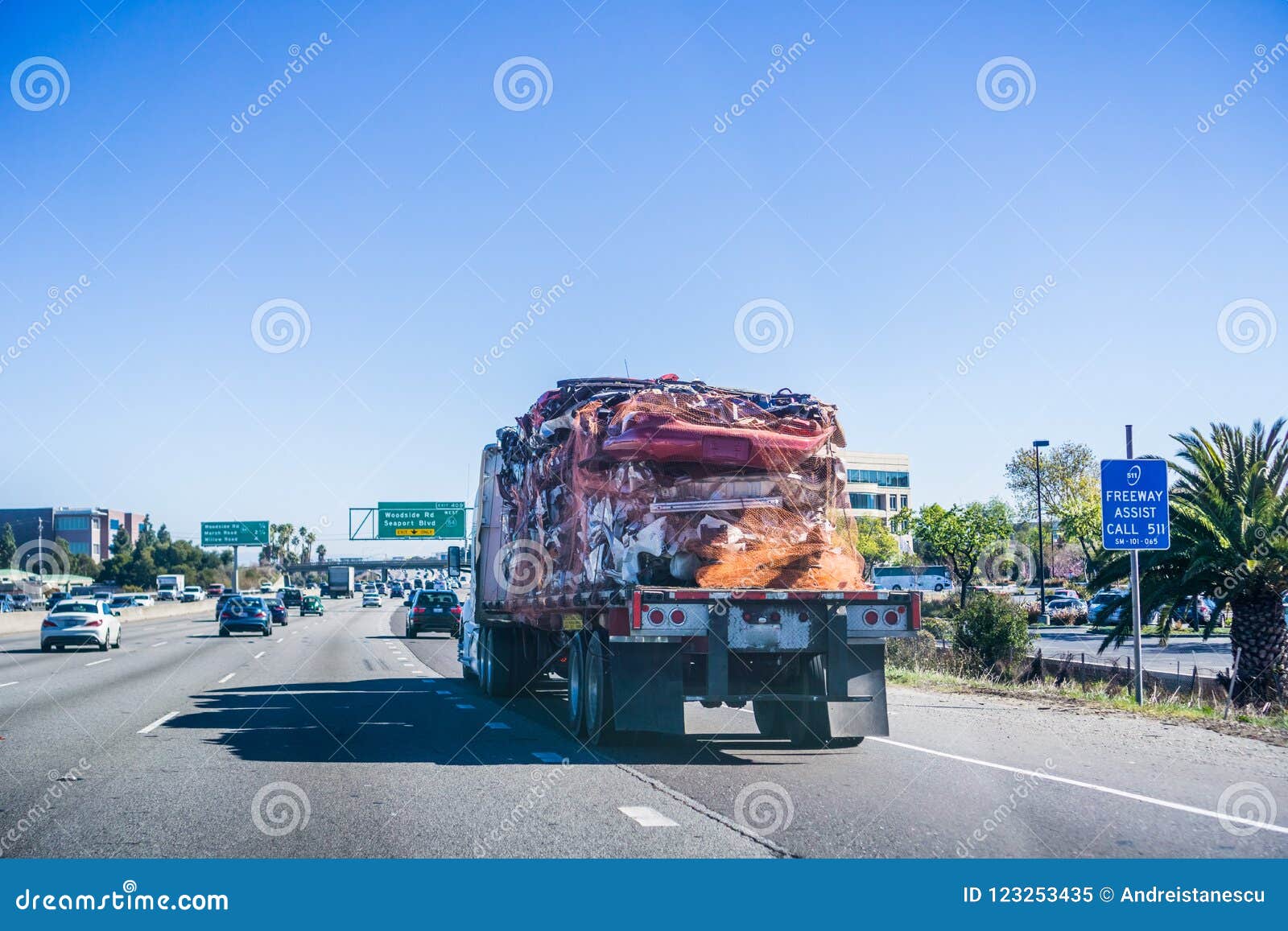 truck carrying crushed car bodies