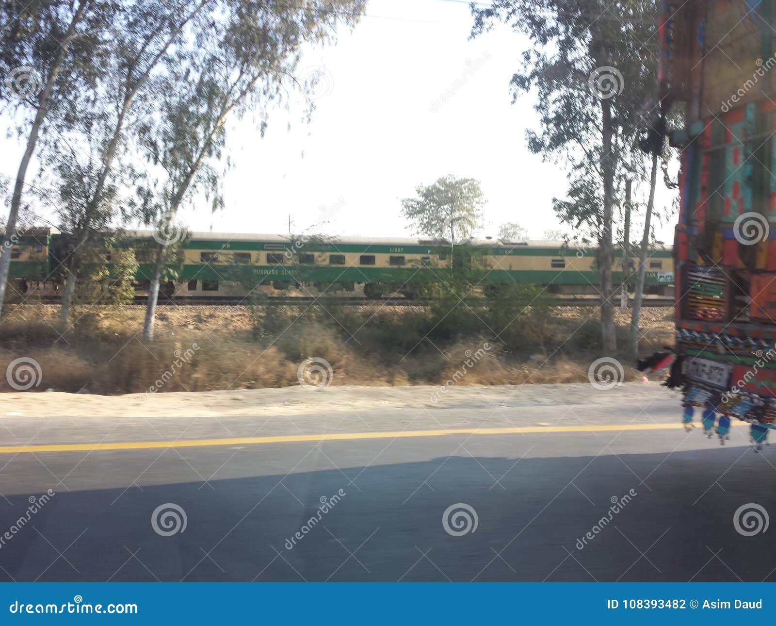Truck, train and car editorial photography. Image of road 108393482