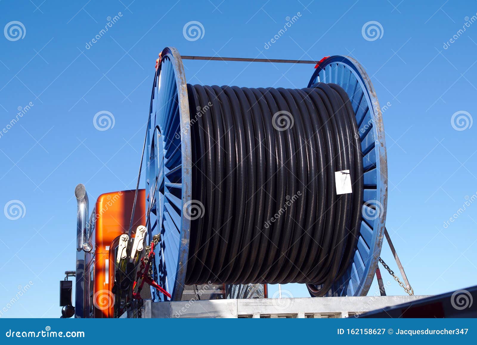 Truck Transporting Electric Wire Spool Large Roll Coil Stock Image