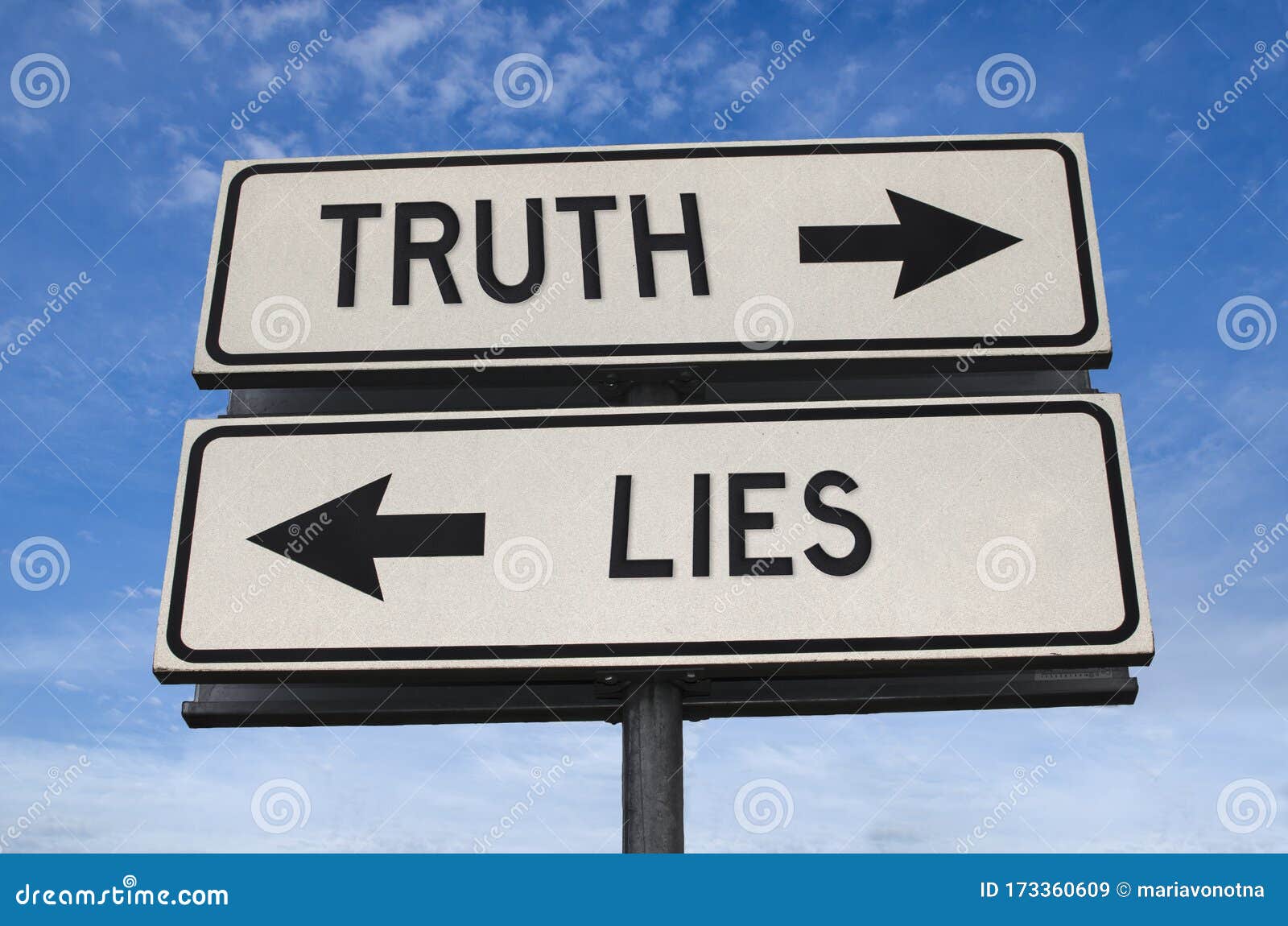 truth vs lies. white two street signs with arrow on metal pole with word