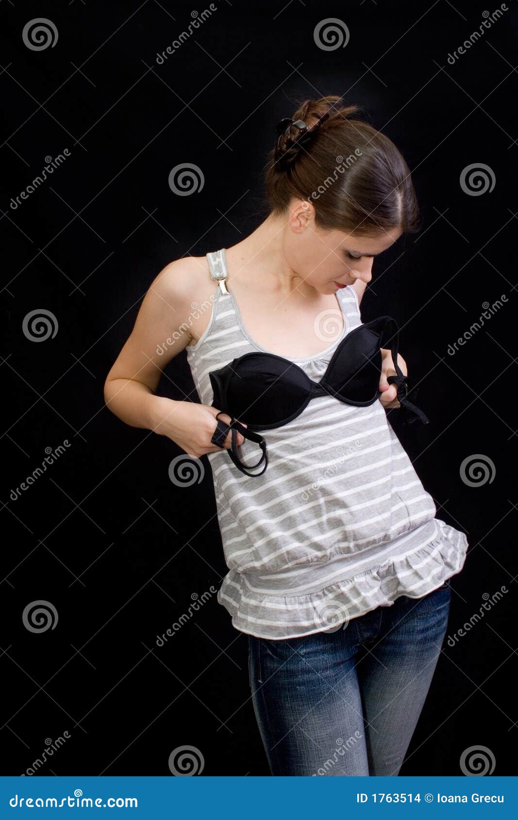 Trying on a Bra stock photo. Image of examine, black, guesstimate - 1763514