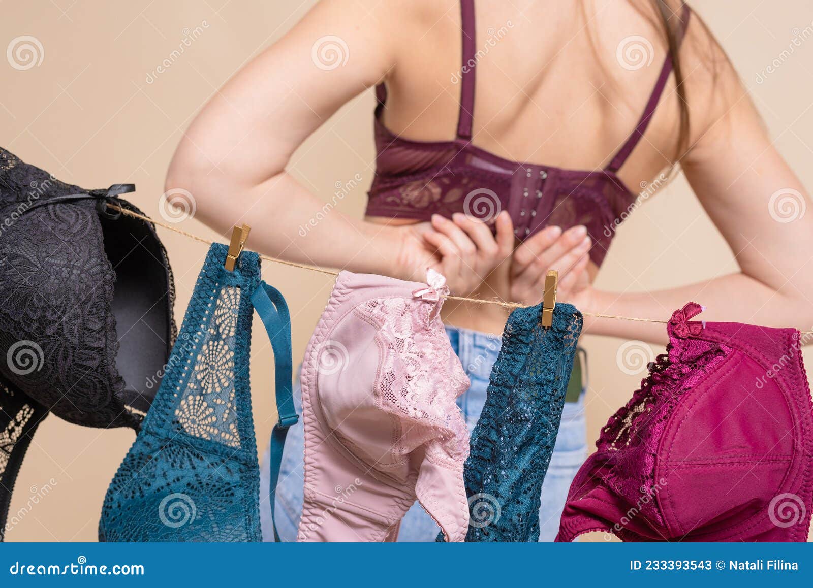 Woman trying on a bra hi-res stock photography and images - Alamy