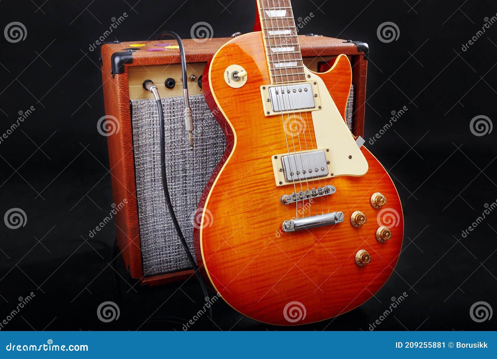 Tube Combo Amplifier for Electric Guitar with Guitar on Black