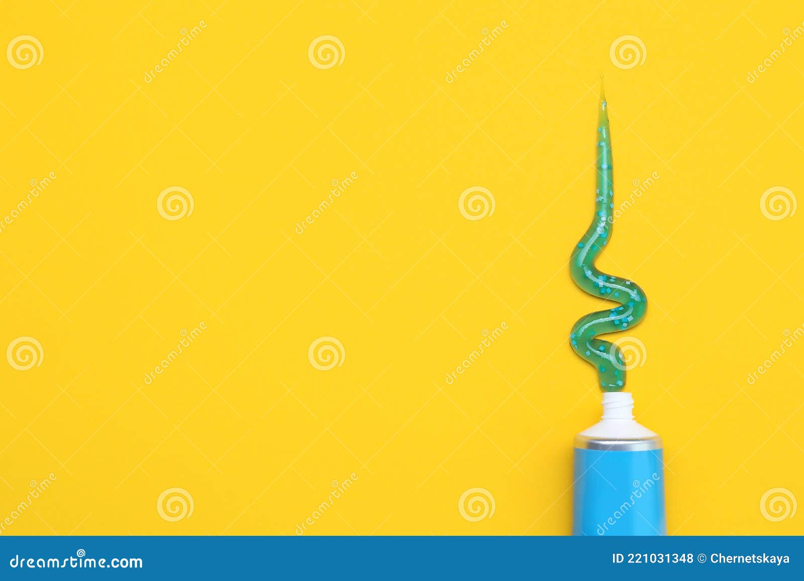 Tube of Toothpaste on Yellow Background, Flat Lay. Space for Text Stock