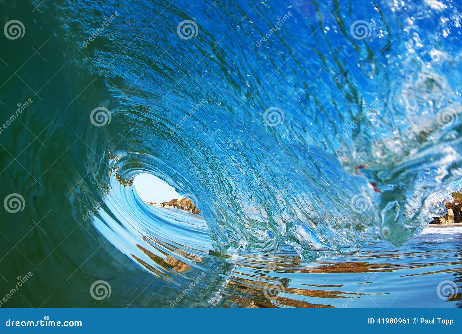 tubular surfing wave breaking near the shore in california