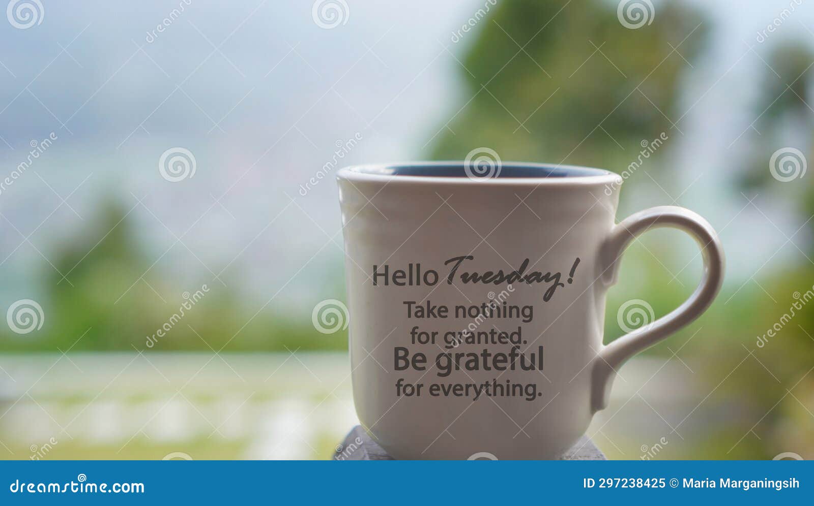tuesday cup of tea or coffee on the table with inspirational text message on it - hello tuesday. take nothing for granted.