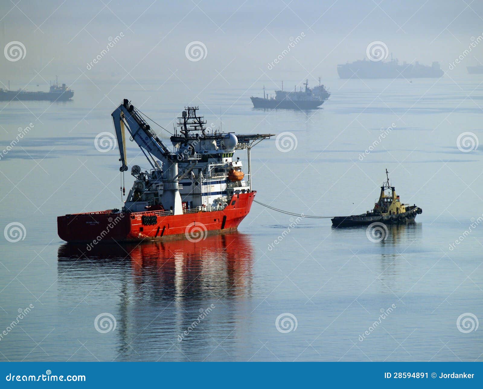 Tug Boat Towing Supply Vessel. Stock Image - Image of blue 