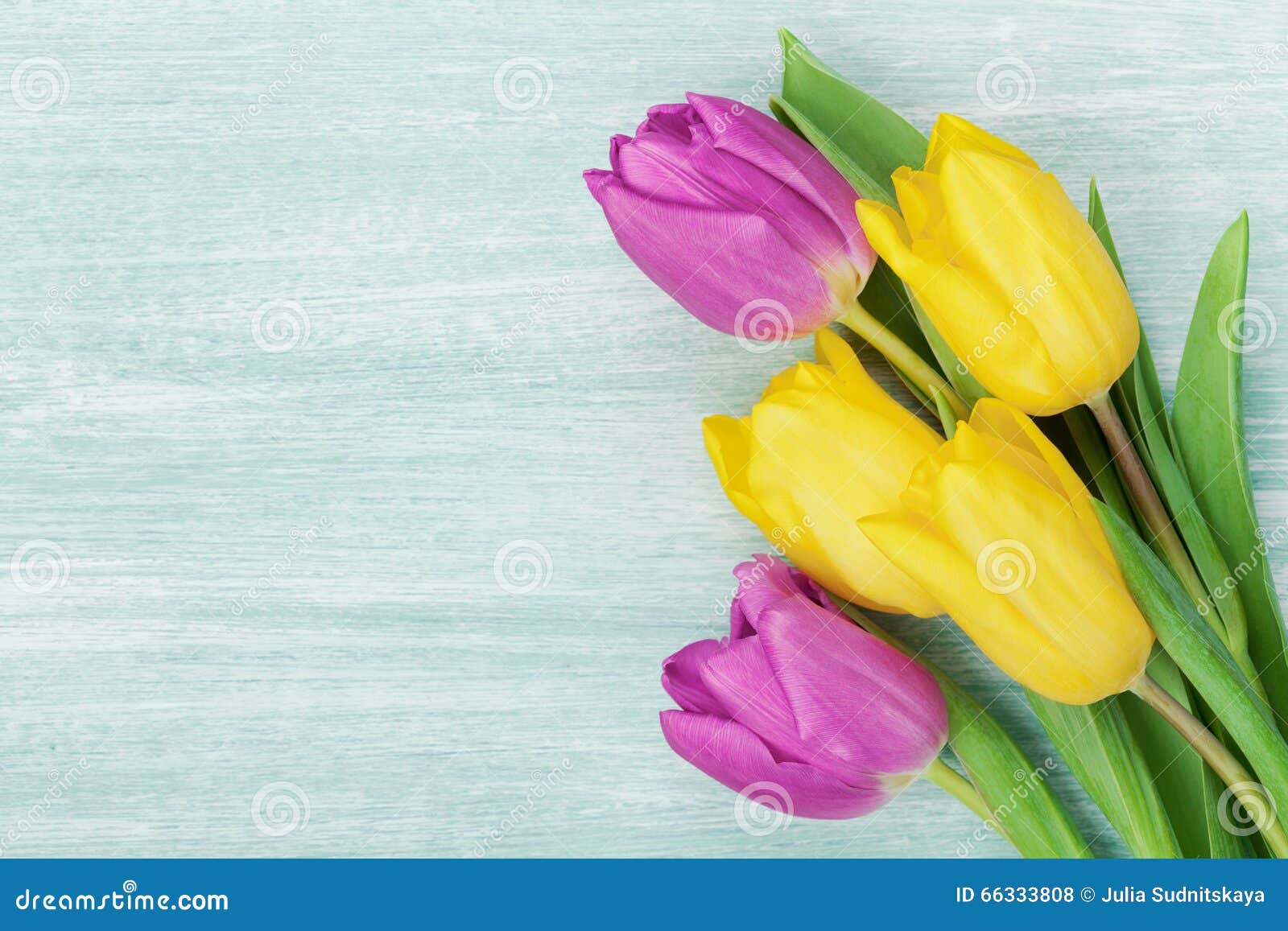 tulip flowers on rustic table for march 8, international womens day, birthday or mothers day, beautiful spring card