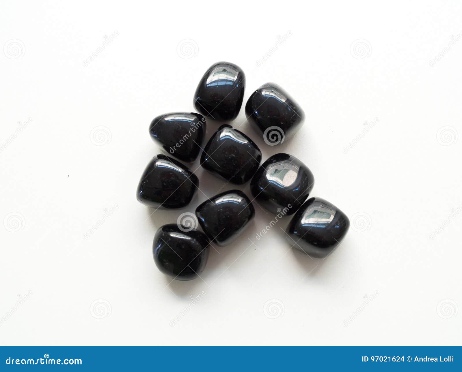 tumbled black obsidian stones close up from top for crystal therapy treatments and reiki