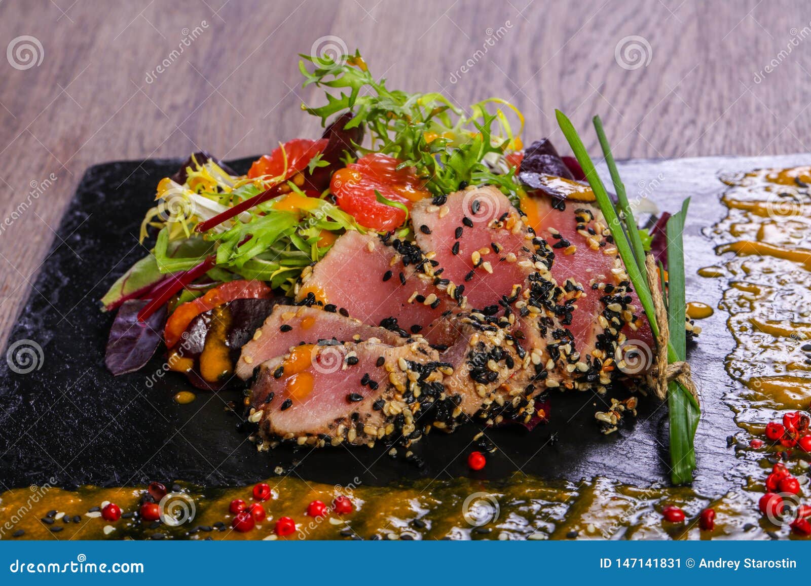 Tuna carpaccio with sauce stock image. Image of nutrition 147141831