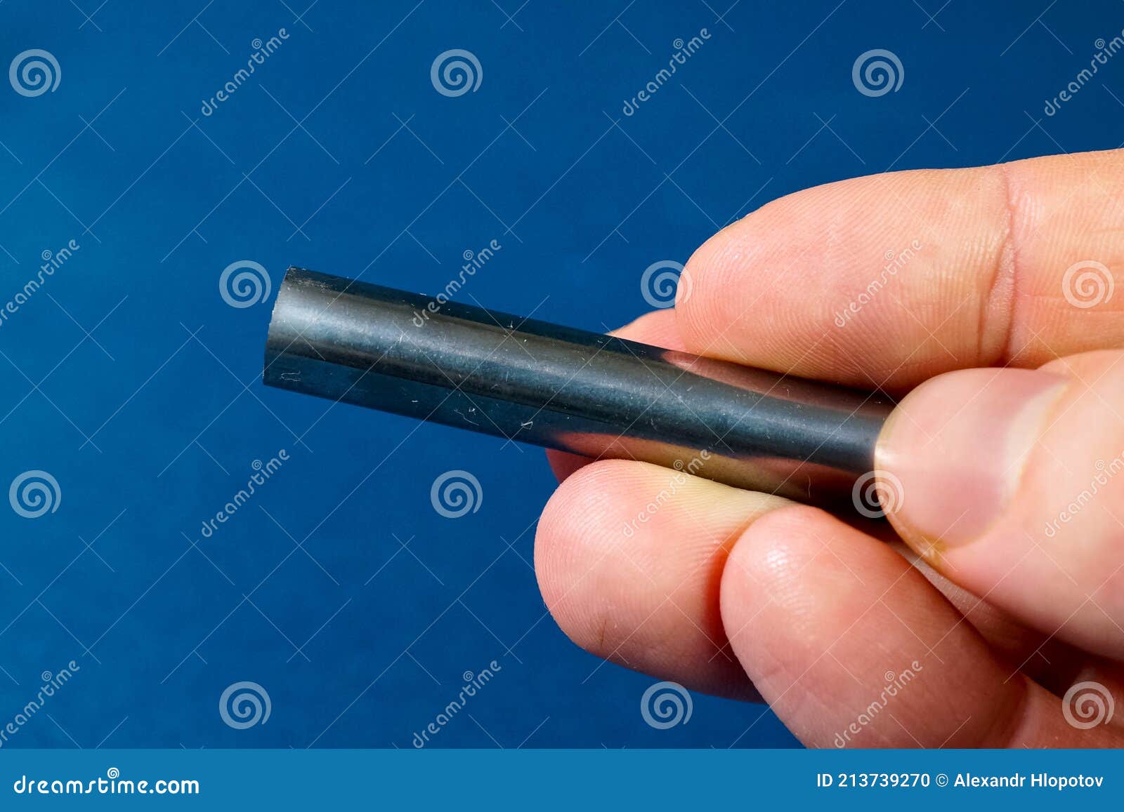 Tungsten Rod in the Hand. a Piece of Tungsten for Stock Photo Image