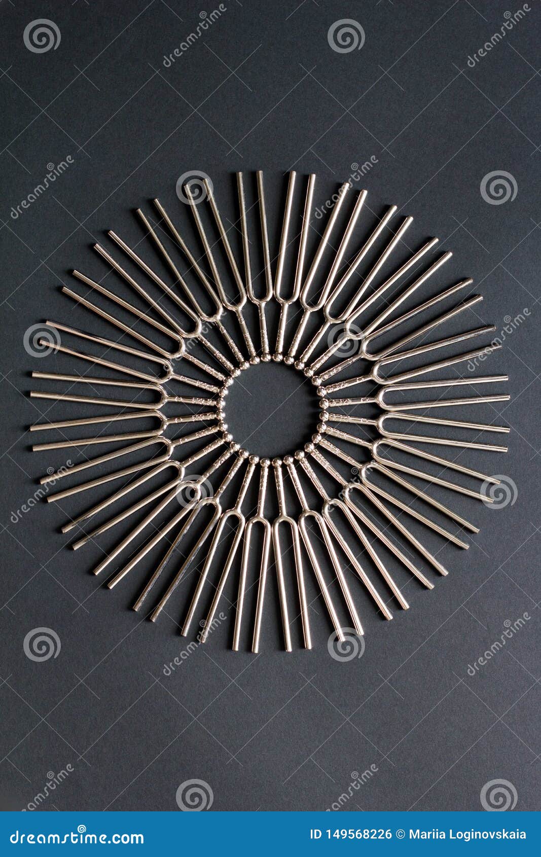 tuning fork round pattern on a black background, centered circular pattern