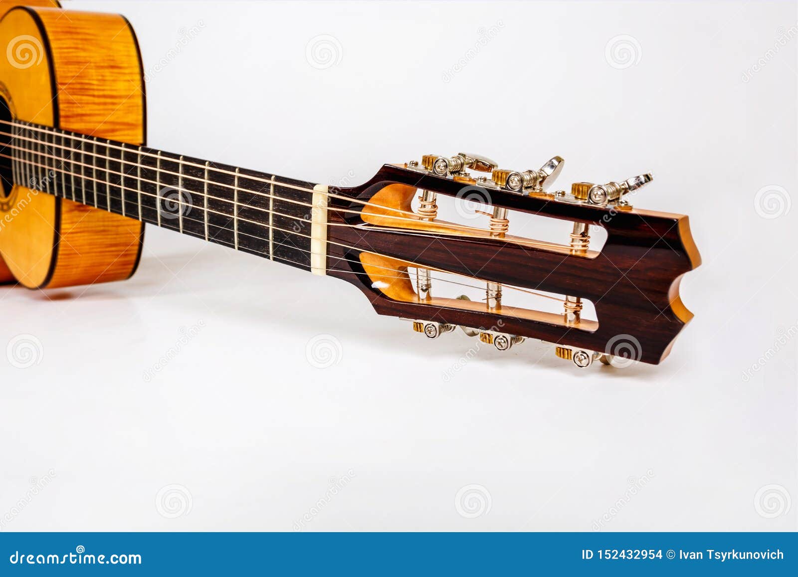 Tuning Pegs on Wooden Machine Head of Six Strings Guitar on White