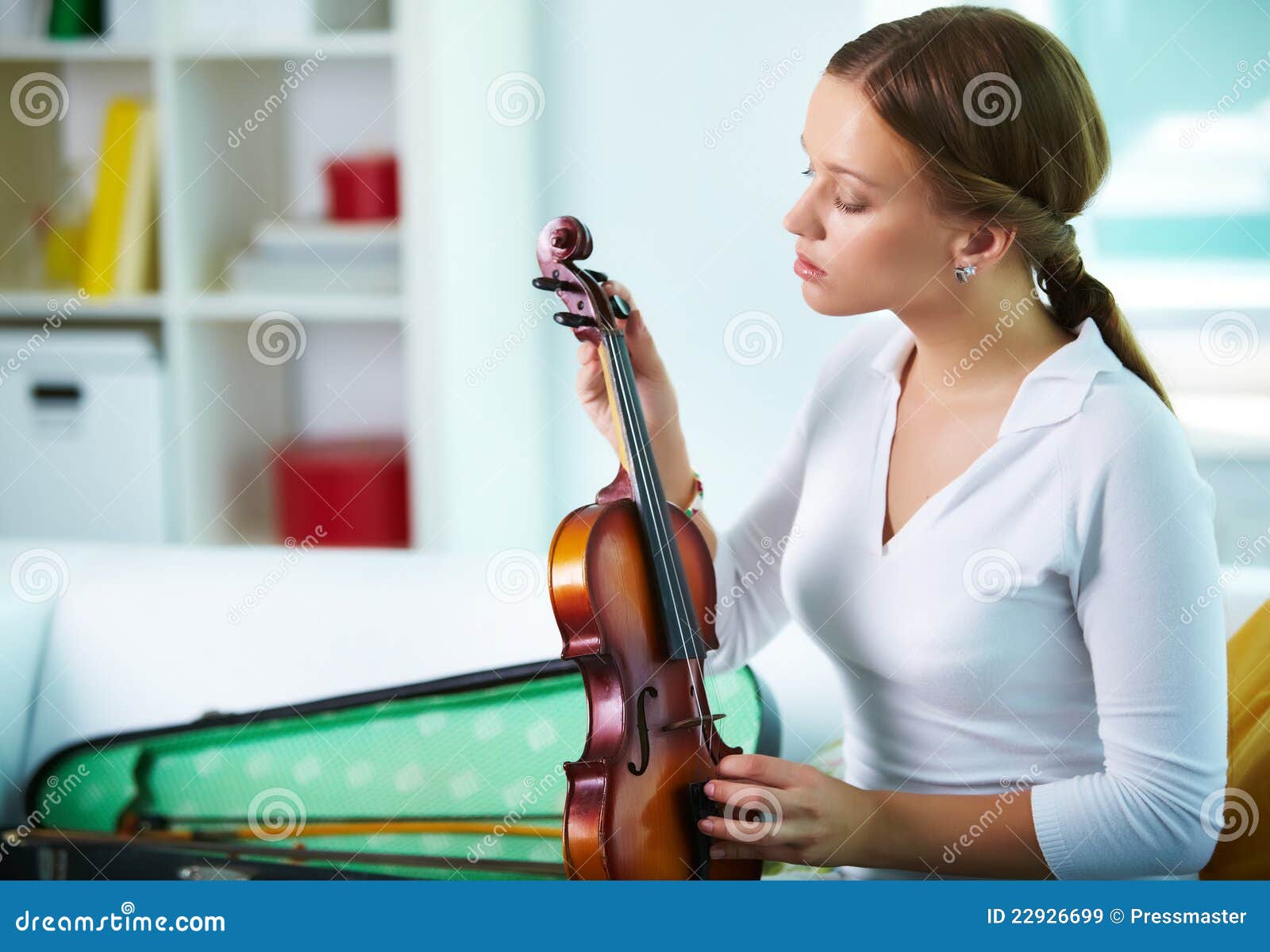Tuning the violin stock image. Image of model, people 22926699