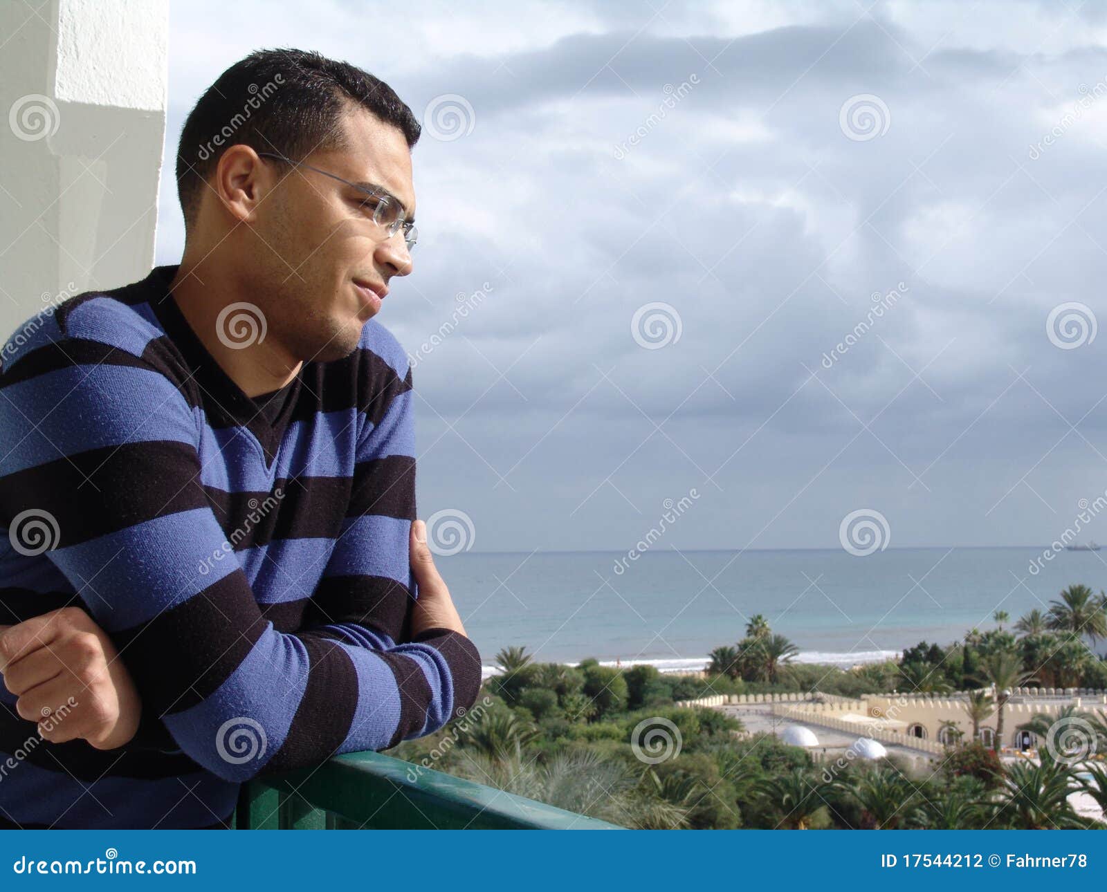 tunisian man watching the ocean