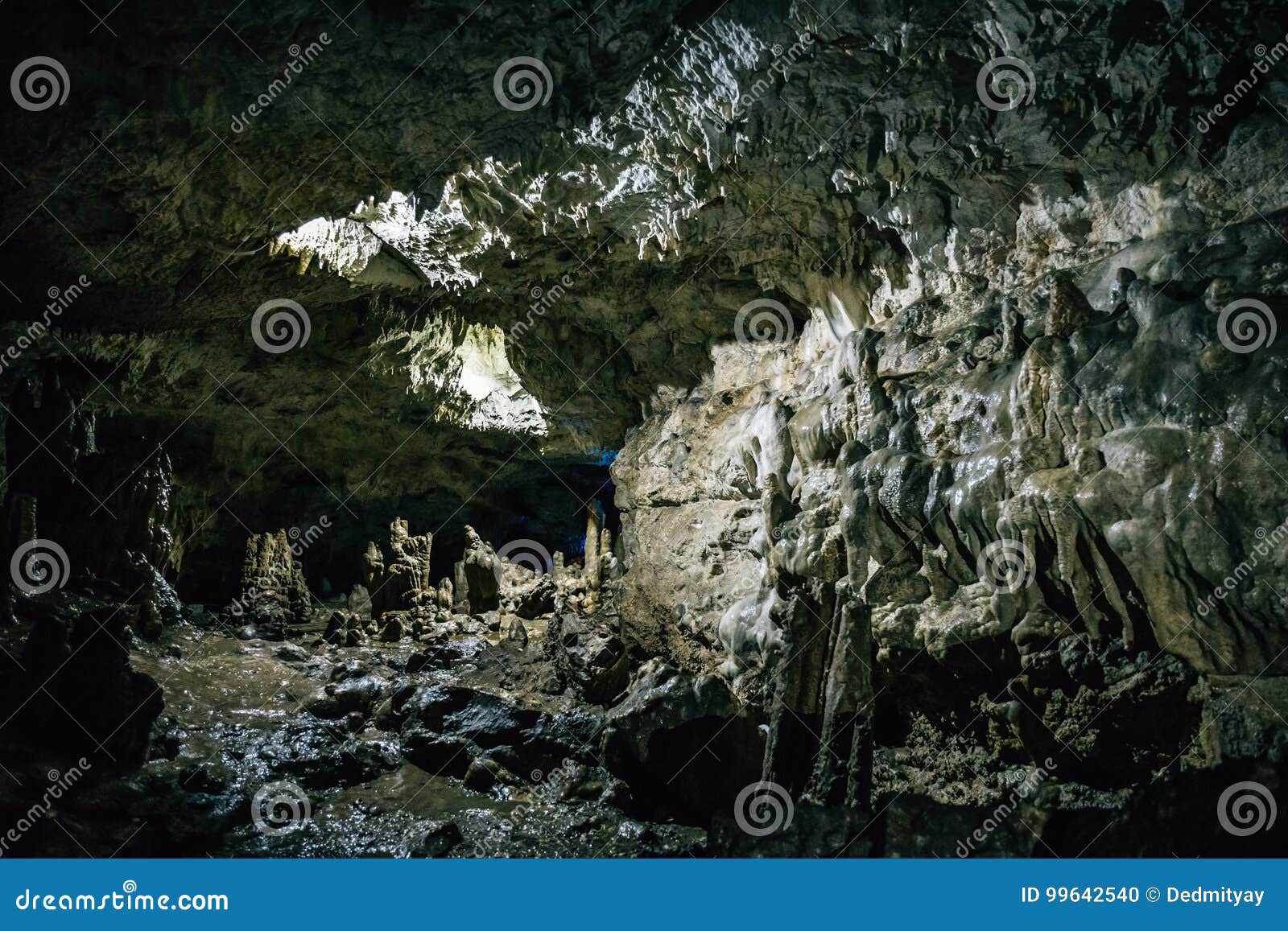 tunnel in cave with stalactites and stalagmites in adygeya