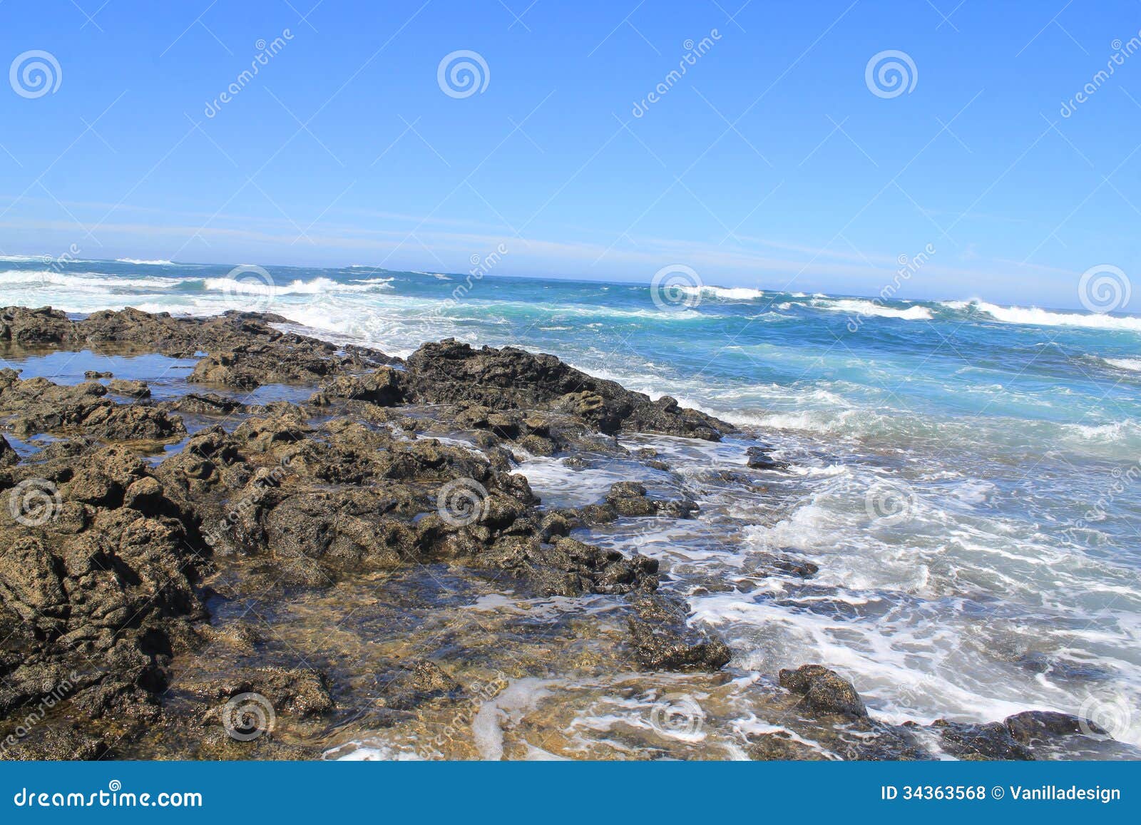 turbulent ocean waves with white foam beat coastal stones, fuerteventura, canary islands at la pared