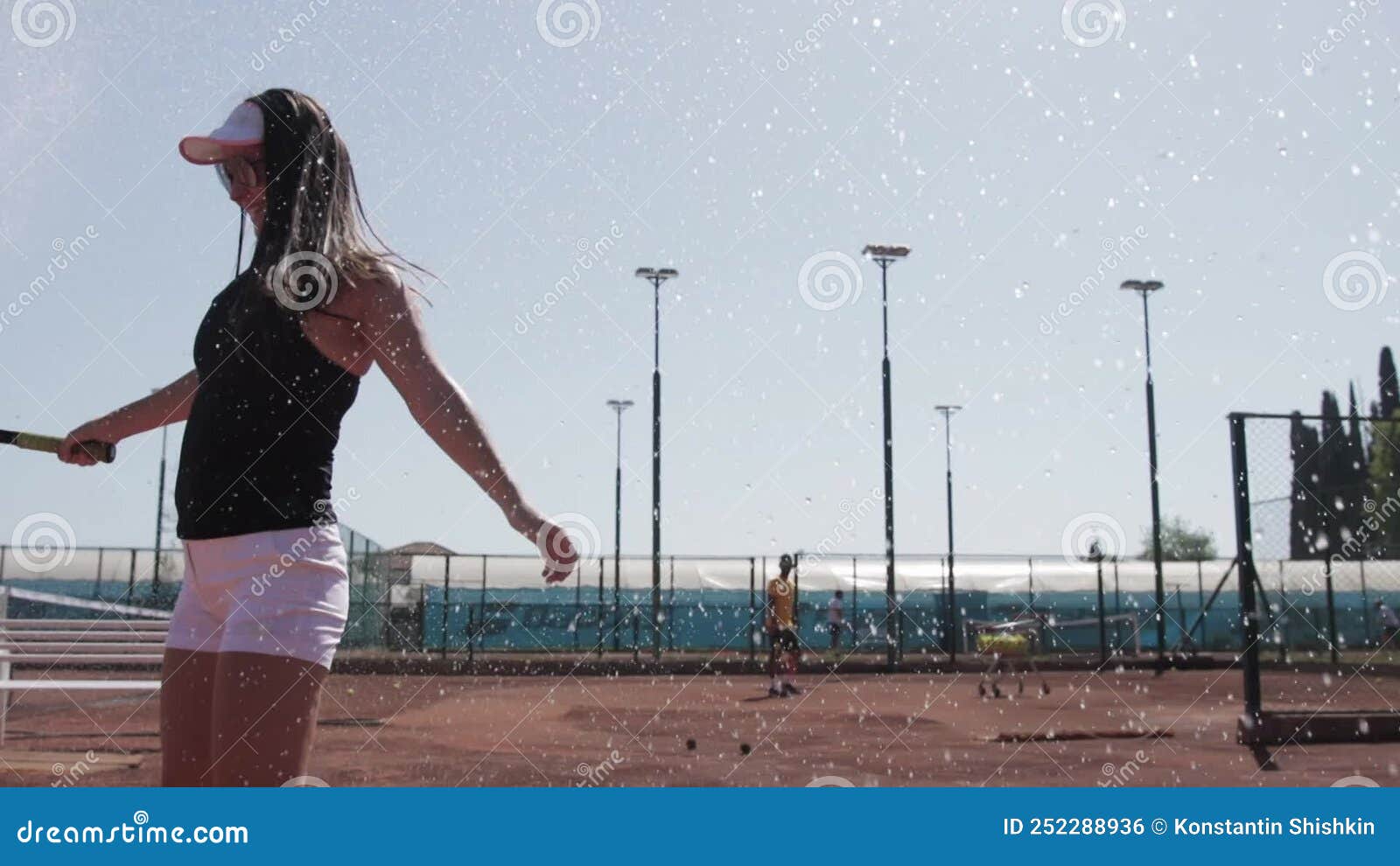 Turkey Antalya Women On Tennis Court Laugh Under Splashed