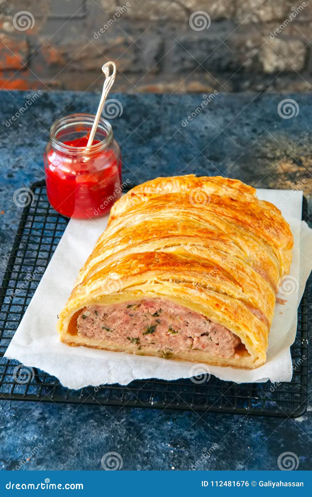 Turkey Meatloaf in a Puff Pastry Served on a Wire Rack. Blue Sto Stock