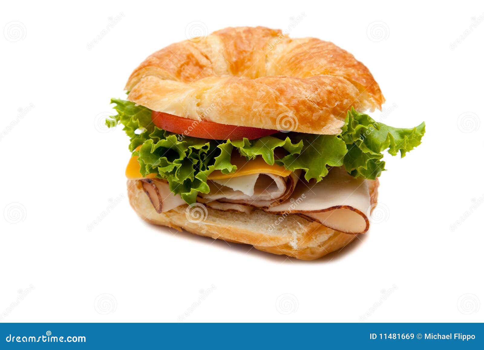 a turkey sandwich on a croissant