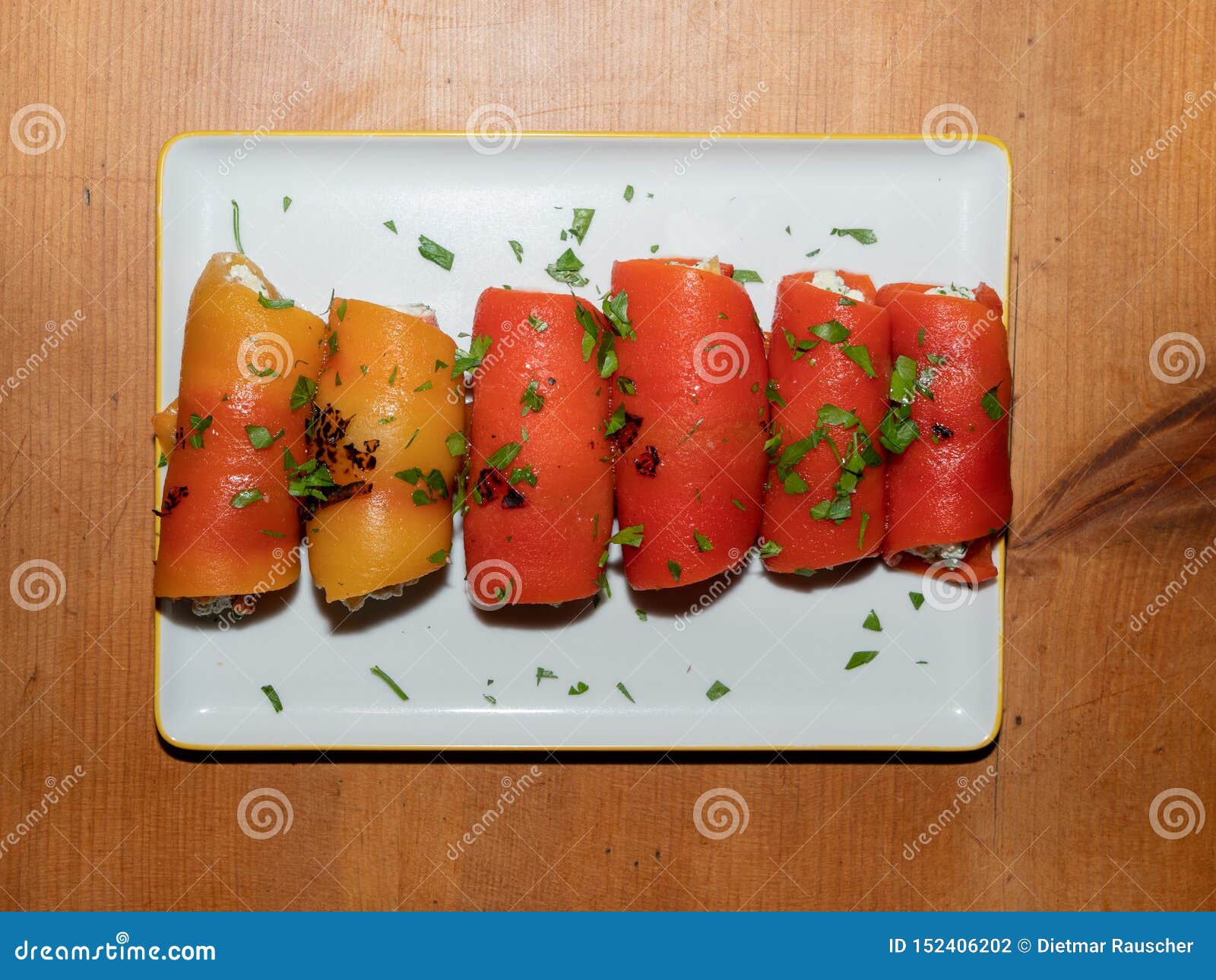 turkish appetizer - red pepper rolls filled with feta and nuts