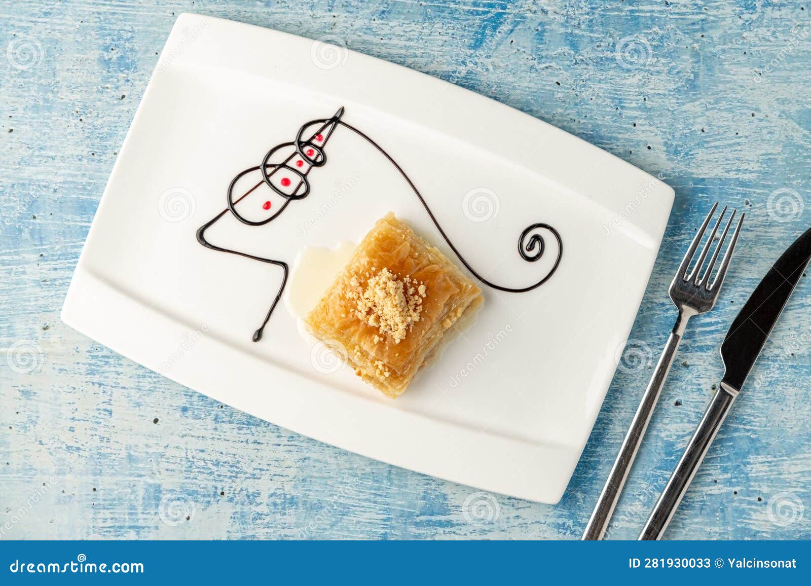 Turkish Baklava with Hazelnuts on a White Porcelain Plate Stock Image