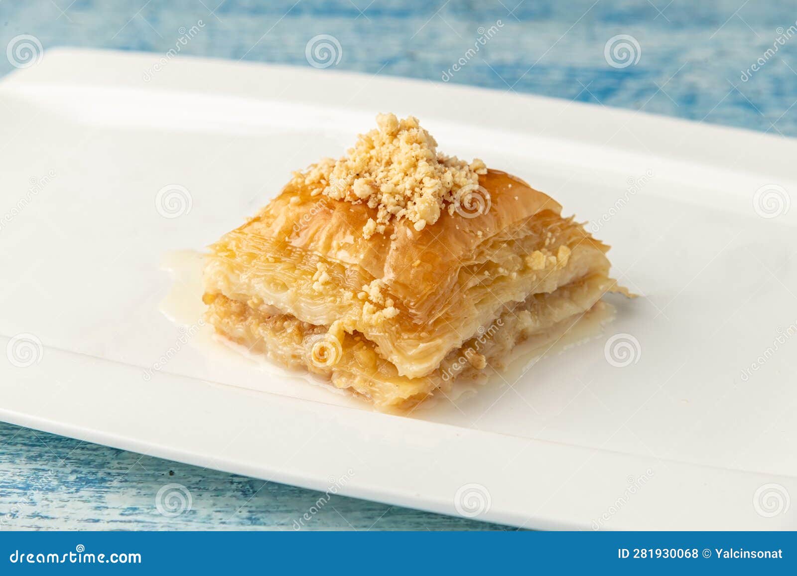 Turkish Baklava with Hazelnuts on a White Porcelain Plate Stock Photo