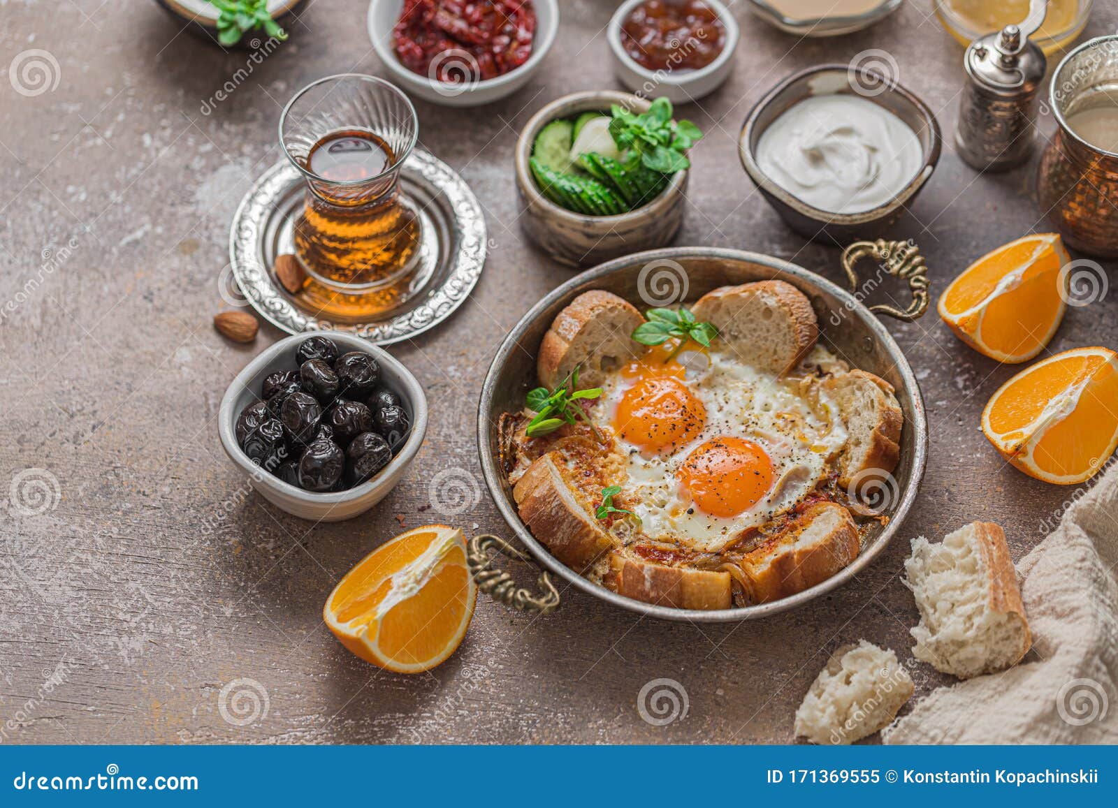 Turkish Breakfast with Fried Eggs, Cheese, Vegetables, Yoghurt and