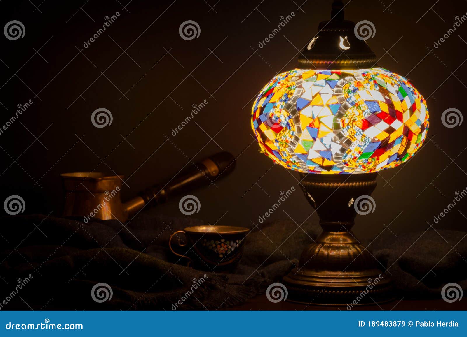 turkish cafe illuminated by turkish lamp on wooden table