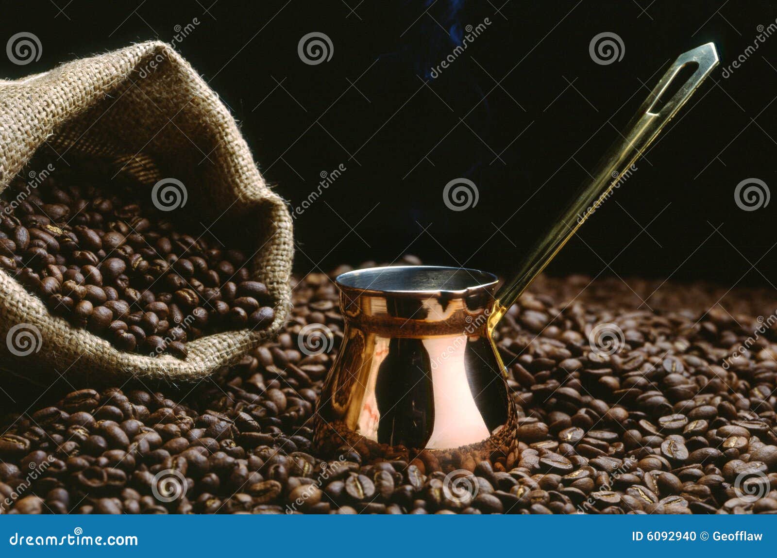 a turkish coffee pot with beans