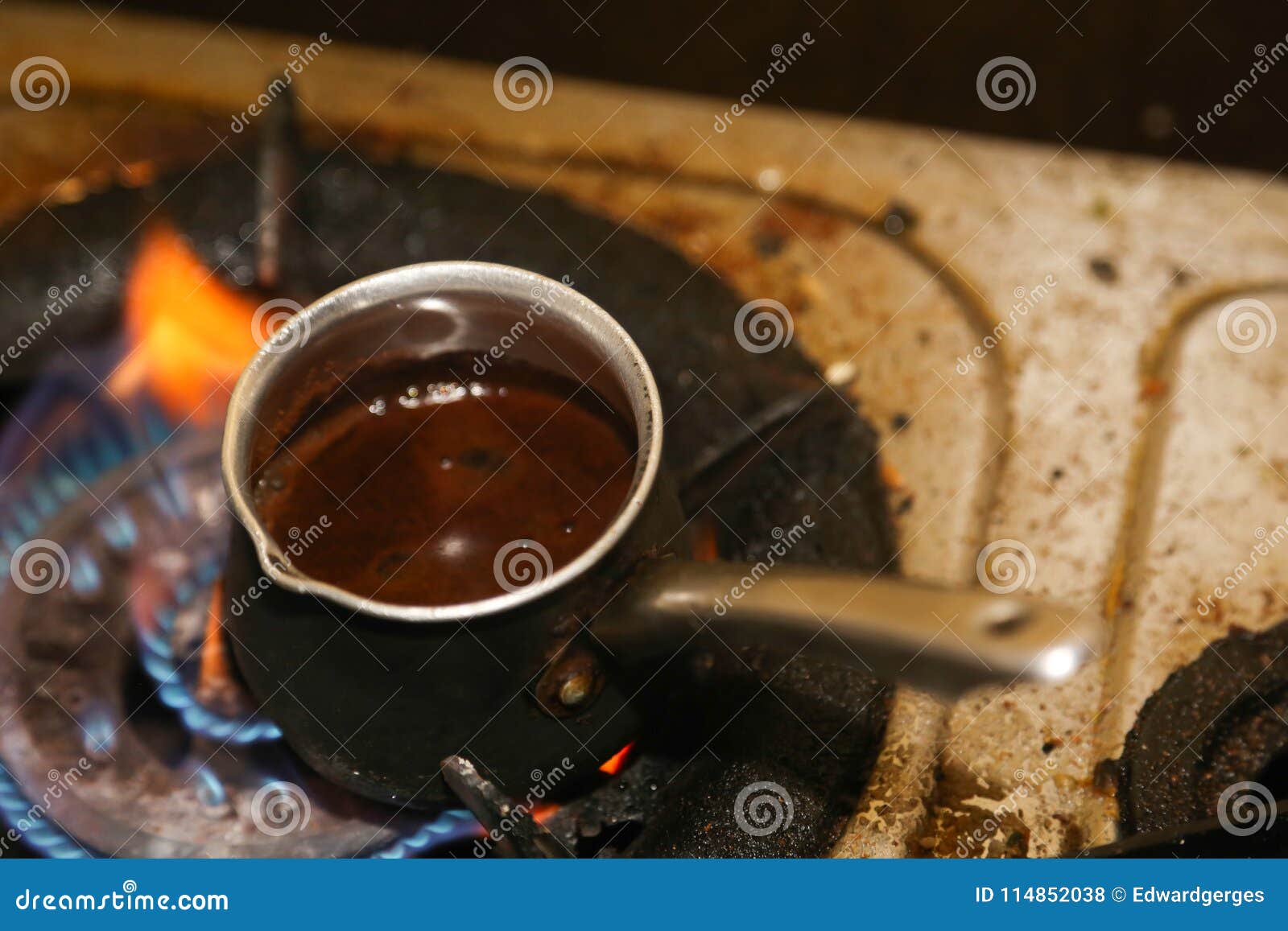 Coffee pot on fire stock photo. Image of drink, white 114852038