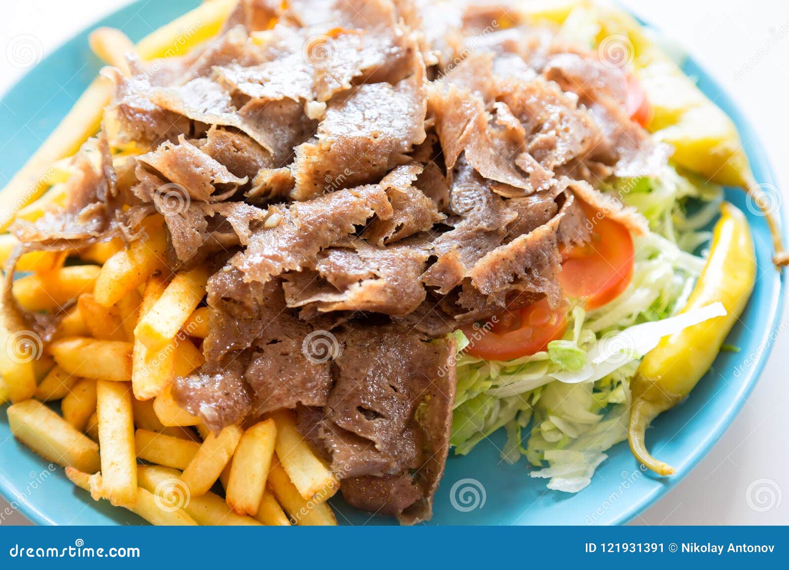 Turkish Cuisine. Doner Kebab Meat With Pommes Frites Potatoes And Salad