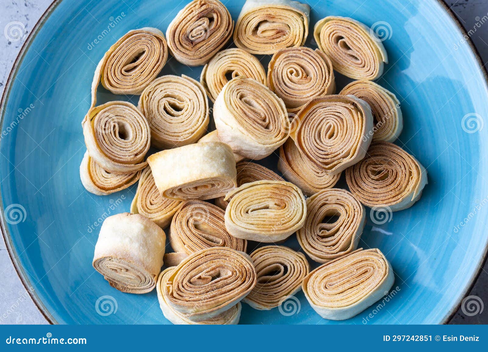 turkish food from artvin called silor - rolled and fried phyllo. silor on blue plate